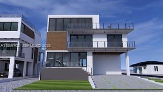 28597 Peg Leg Road Summerland Key, FL 33042 - Photo 3 of 20 a front view of a house with a yard garage and outdoor seating