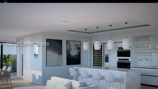 28597 Peg Leg Road Summerland Key, FL 33042 - Photo 5 of 20 a view of a kitchen with refrigerator and wooden floor