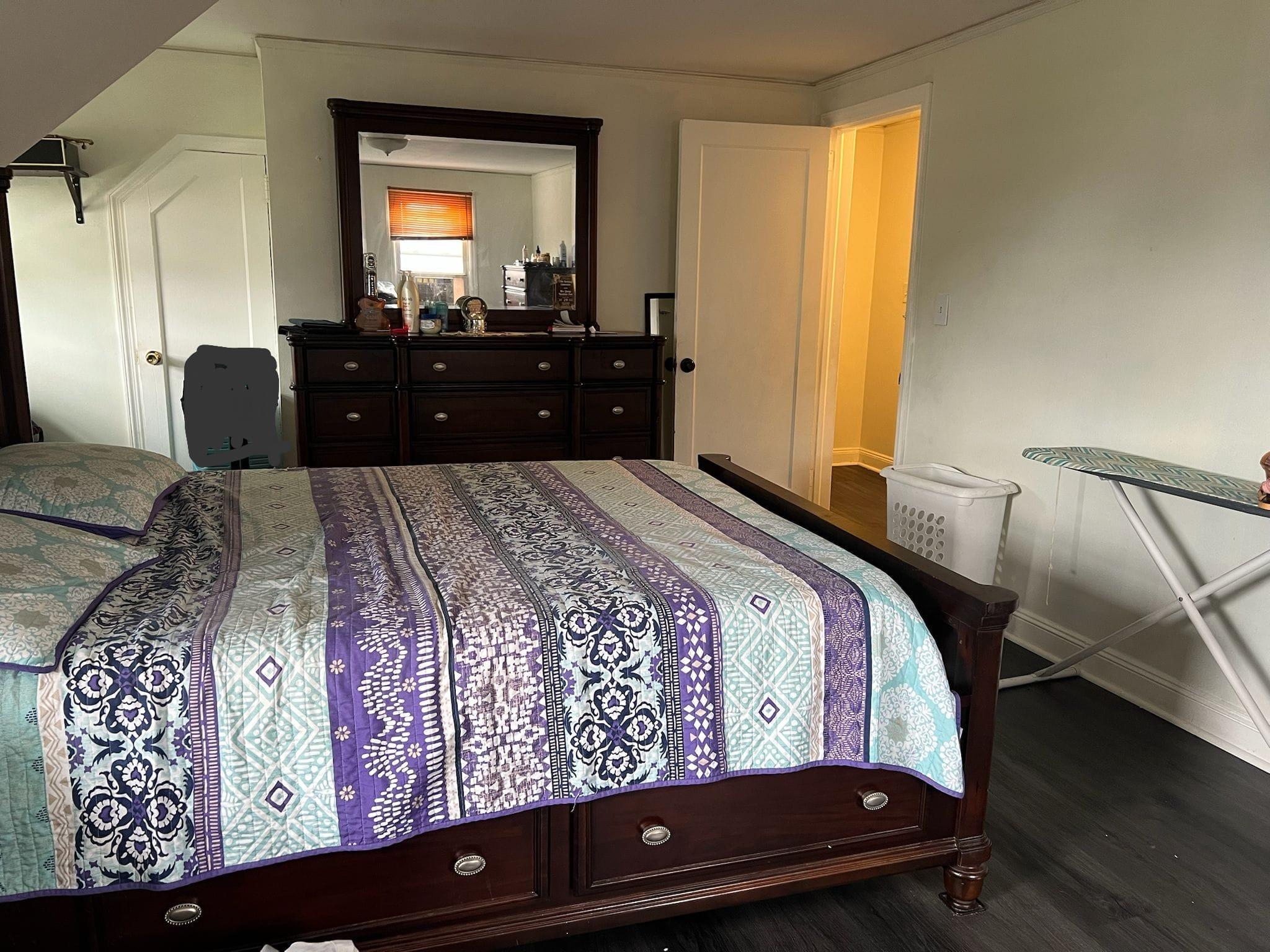 182 Long Beach Road Hempstead, NY 11550 - Photo 15 of 24 a bedroom with a bed window and dresser