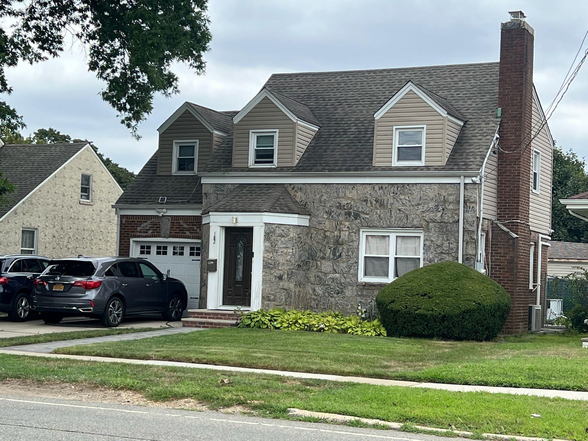 182 Long Beach Road Hempstead, NY 11550 - Photo 2 of 24 a view of a house with a yard