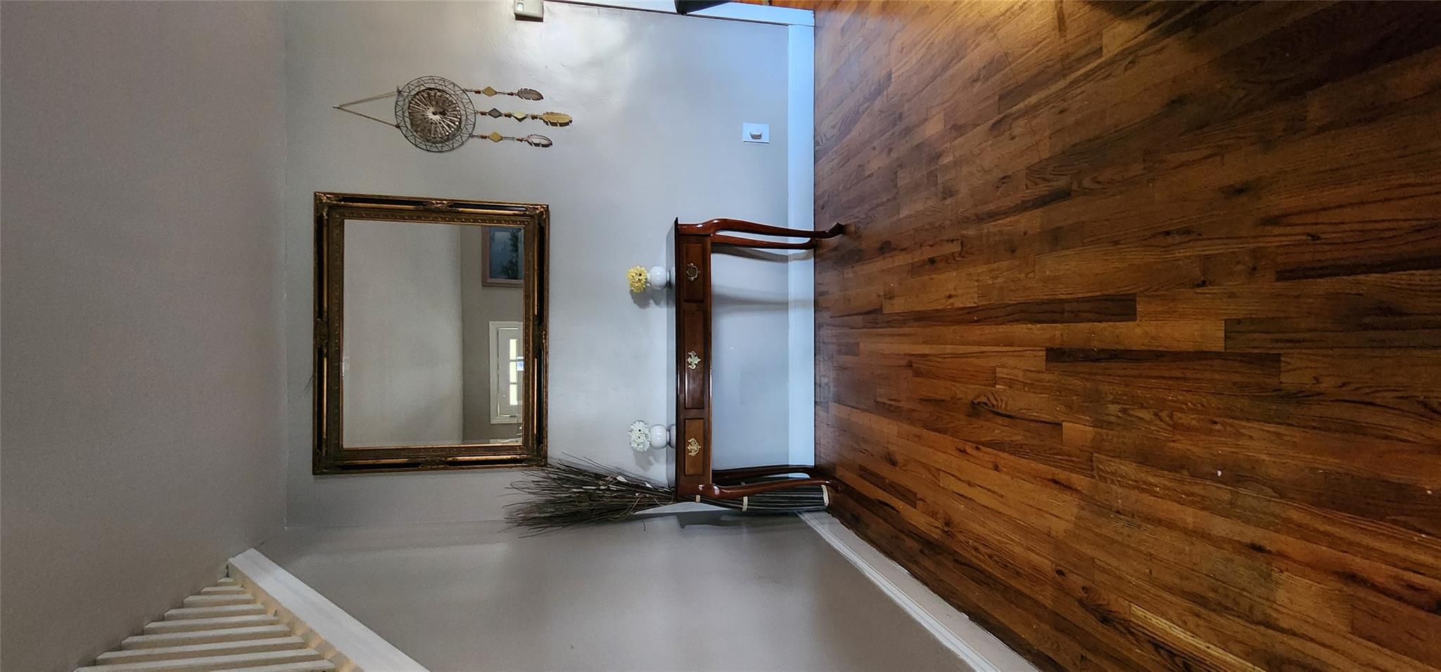 182 Long Beach Road Hempstead, NY 11550 - Photo 23 of 24 a view of a room with wooden floor and cabinet