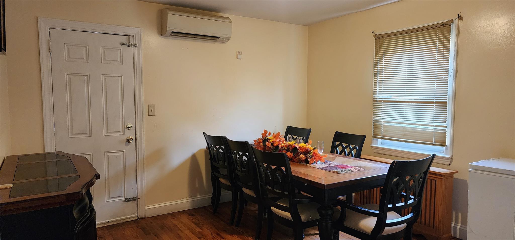 182 Long Beach Road Hempstead, NY 11550 - Photo 8 of 24 a view of a dining room with furniture and wooden floor