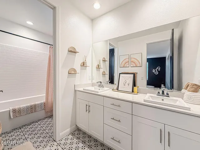 a living room with couches and a large window