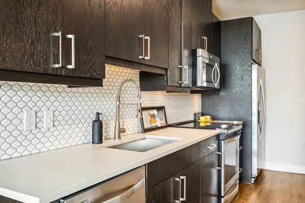 a bedroom with two beds and a large window