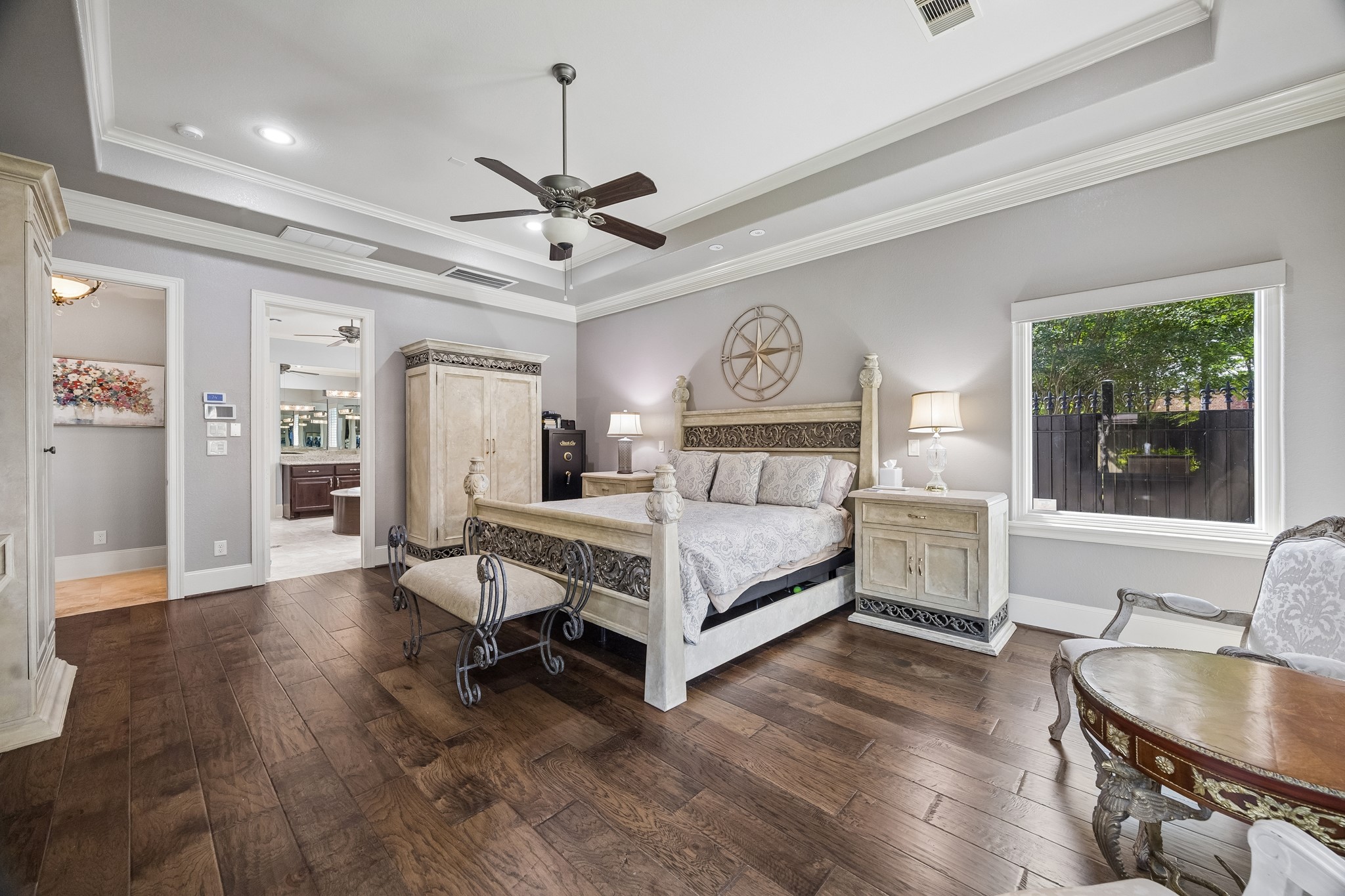 3914 Louvre Lane Houston, TX 77082 - Photo 20 of 31 a bedroom with a bed and a chandelier