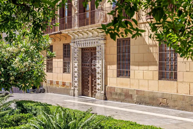 a front view of a building with a street