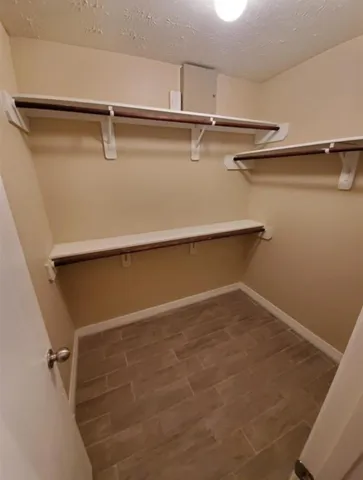 a view of a room with racks on the wall