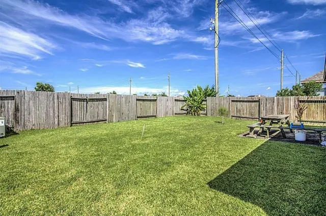 a view of a backyard with sitting area