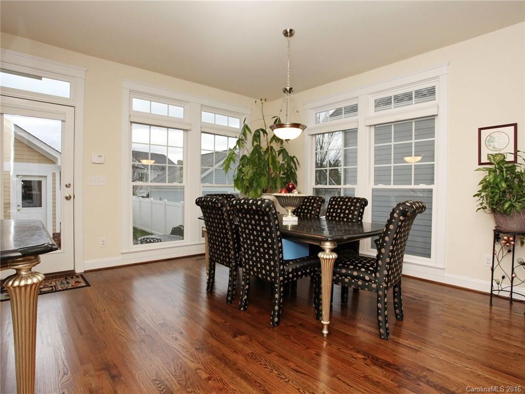 660 Revival Row Fort Mill, SC 29708 - Photo 12 of 24 a view of a dining room with furniture window and wooden floor