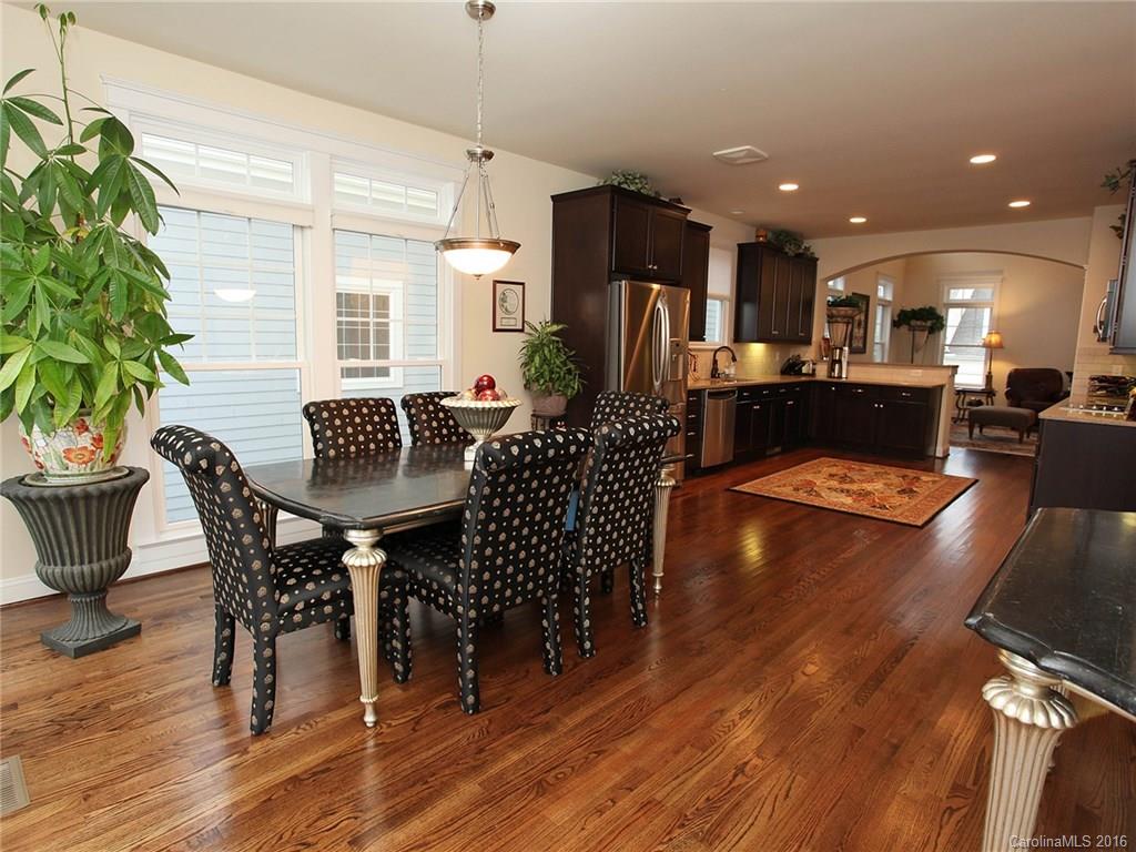 660 Revival Row Fort Mill, SC 29708 - Photo 13 of 24 a view of a dining room with furniture and wooden floor