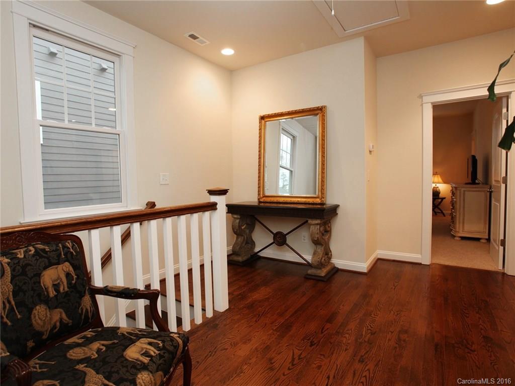660 Revival Row Fort Mill, SC 29708 - Photo 20 of 24 a view of a hallway with wooden floor and a window