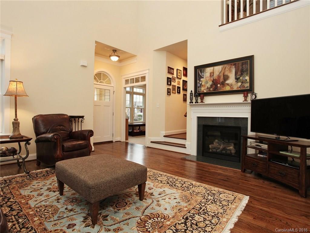 660 Revival Row Fort Mill, SC 29708 - Photo 5 of 24 a living room with furniture a flat screen tv and a fireplace