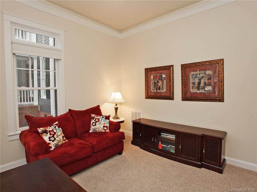 660 Revival Row Fort Mill, SC 29708 - Photo 7 of 24 a living room with furniture a lamp and a window