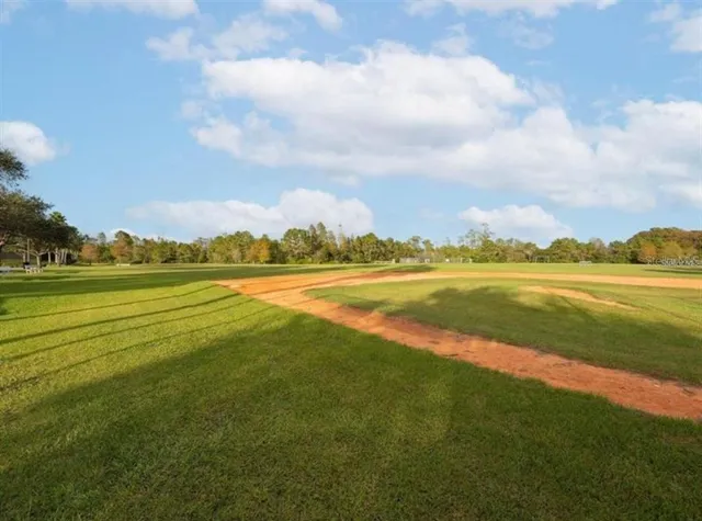 a view of a lake with houses in the background