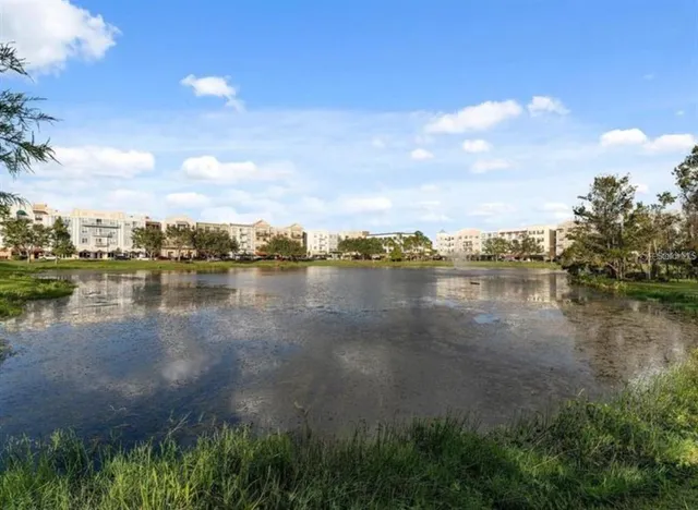 a view of a lake with houses in the back
