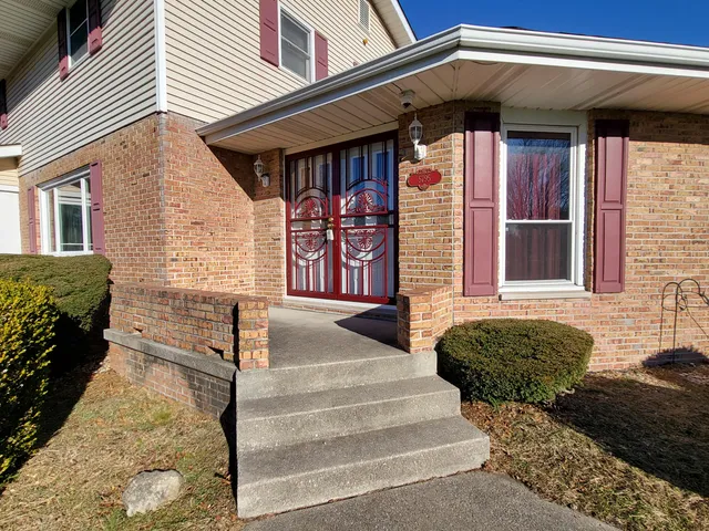 a kitchen with stainless steel appliances granite countertop a sink a stove a microwave and cabinets