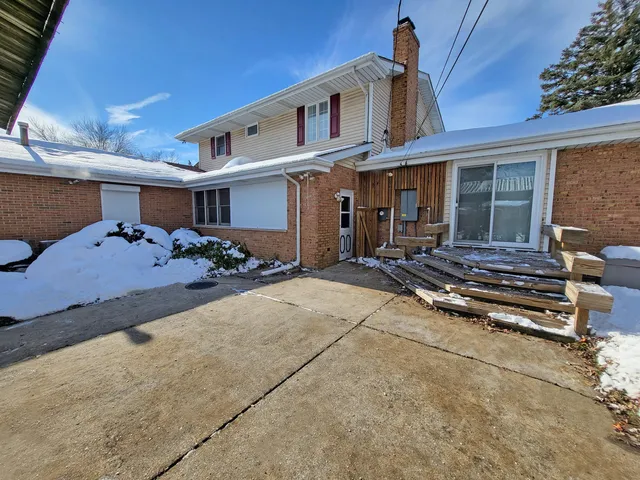 a front view of a house with many windows
