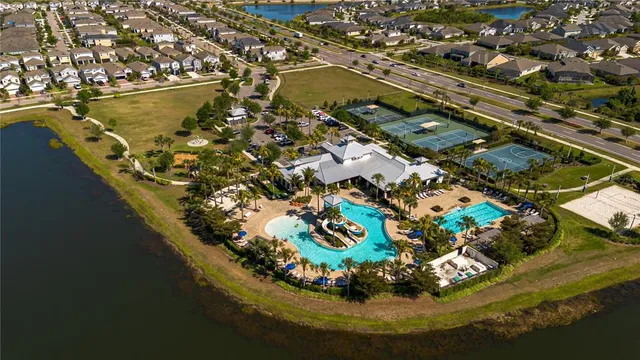 an aerial view of residential houses with outdoor space