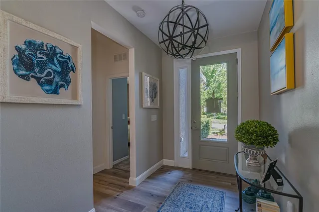 a view of entryway with a flower pot and a bookshelf