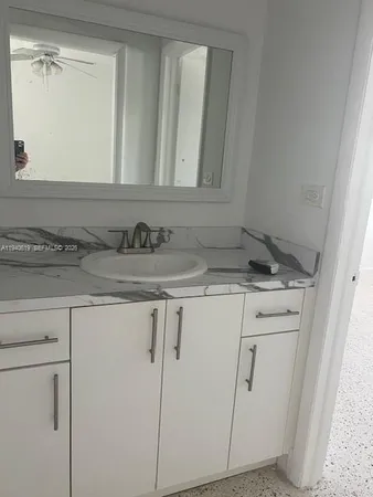 a bath room with a toilet and a bath tub