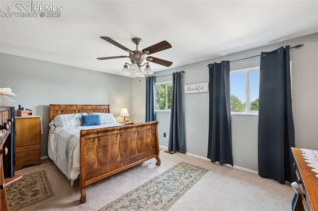 a bed room with a bed and a chandelier