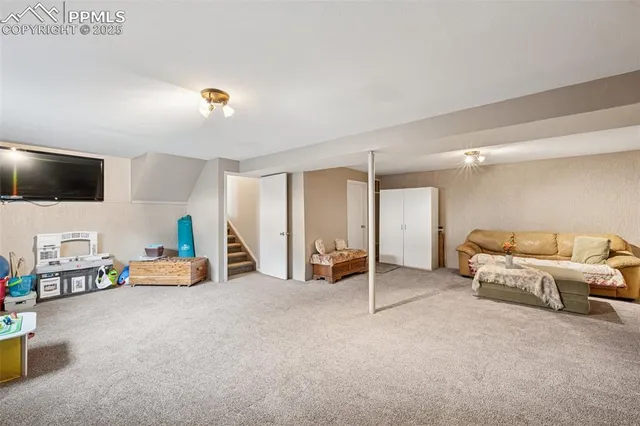 a view of a livingroom with furniture and a flat screen tv