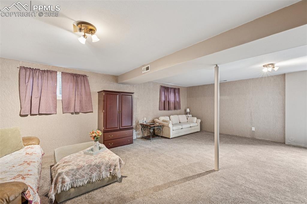 5560 Constitution Avenue Colorado Springs, CO 80917 - Photo 25 of 30 a bedroom with bed and window