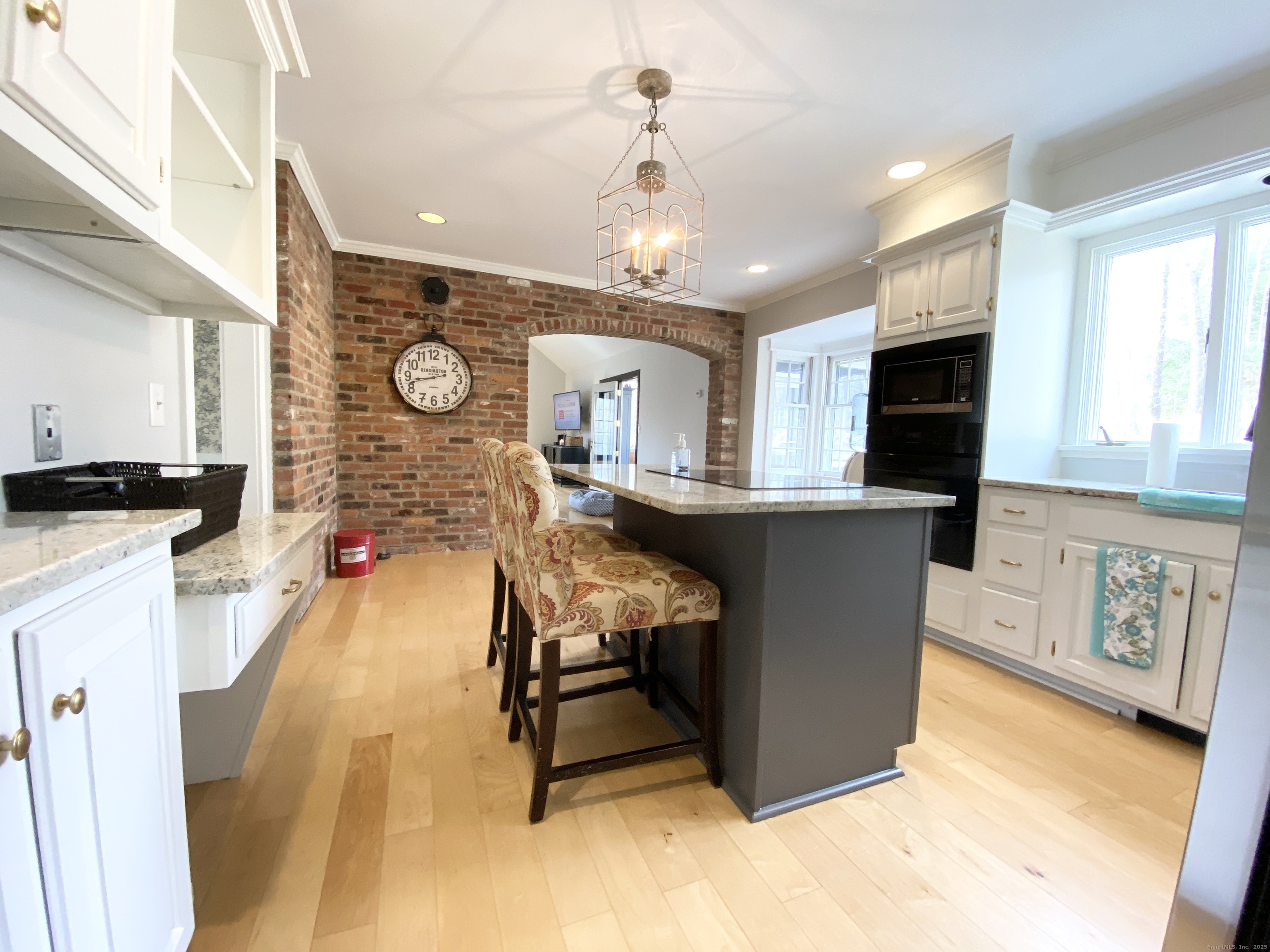 61 High Rock Road Newtown, CT 06482 - Photo 2 of 14 a living room with furniture and a flat screen tv