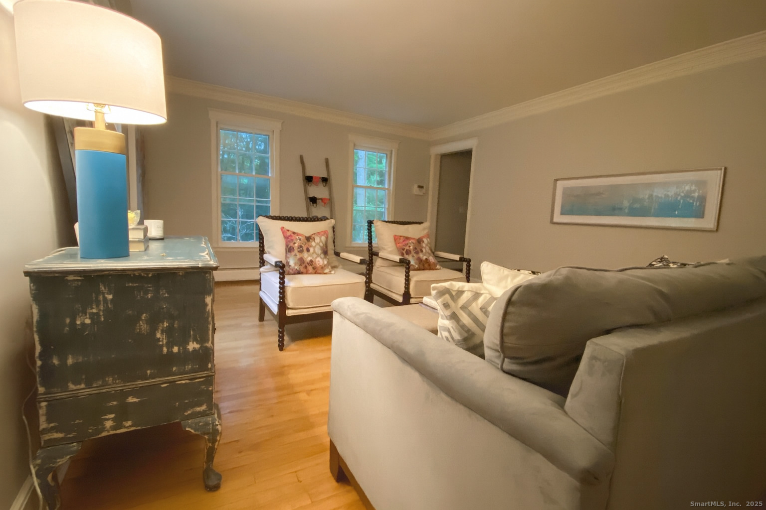 61 High Rock Road Newtown, CT 06482 - Photo 7 of 14 a living room with furniture and a lamp
