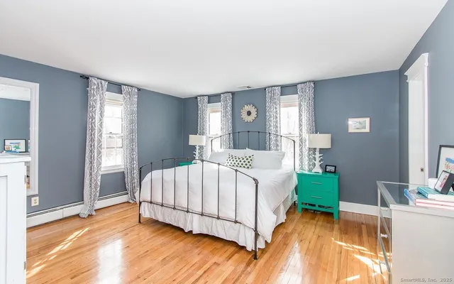 a bedroom with a bed and a view of bedroom