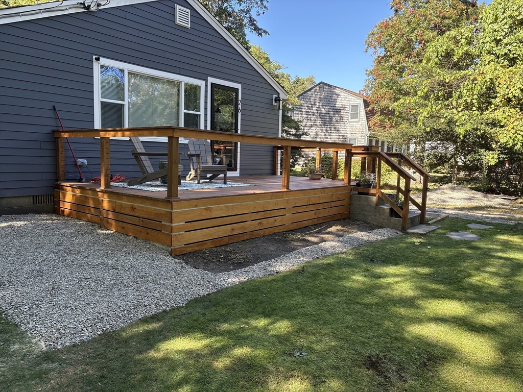 26 Highland Street Mashpee, MA 02649 - Photo 1 of 20 a house view with a sitting space and garden