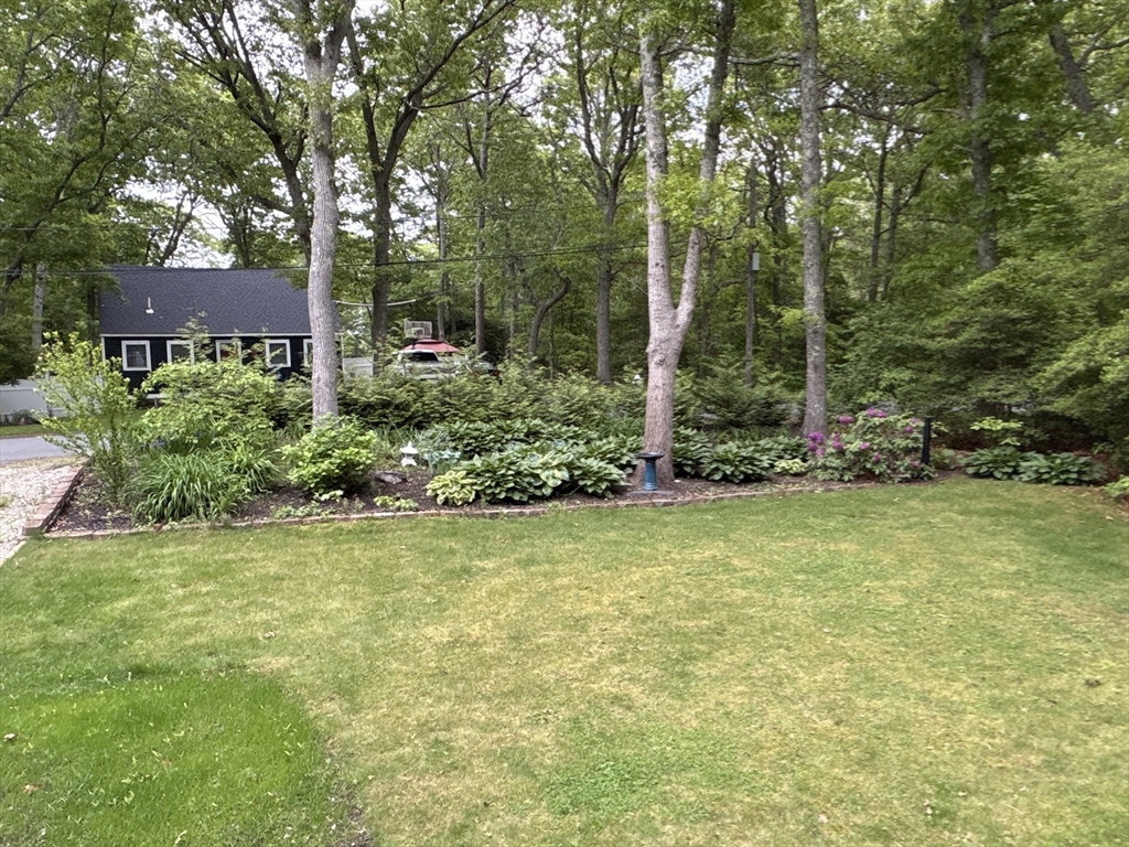 26 Highland Street Mashpee, MA 02649 - Photo 16 of 20 front view of a house with a yard
