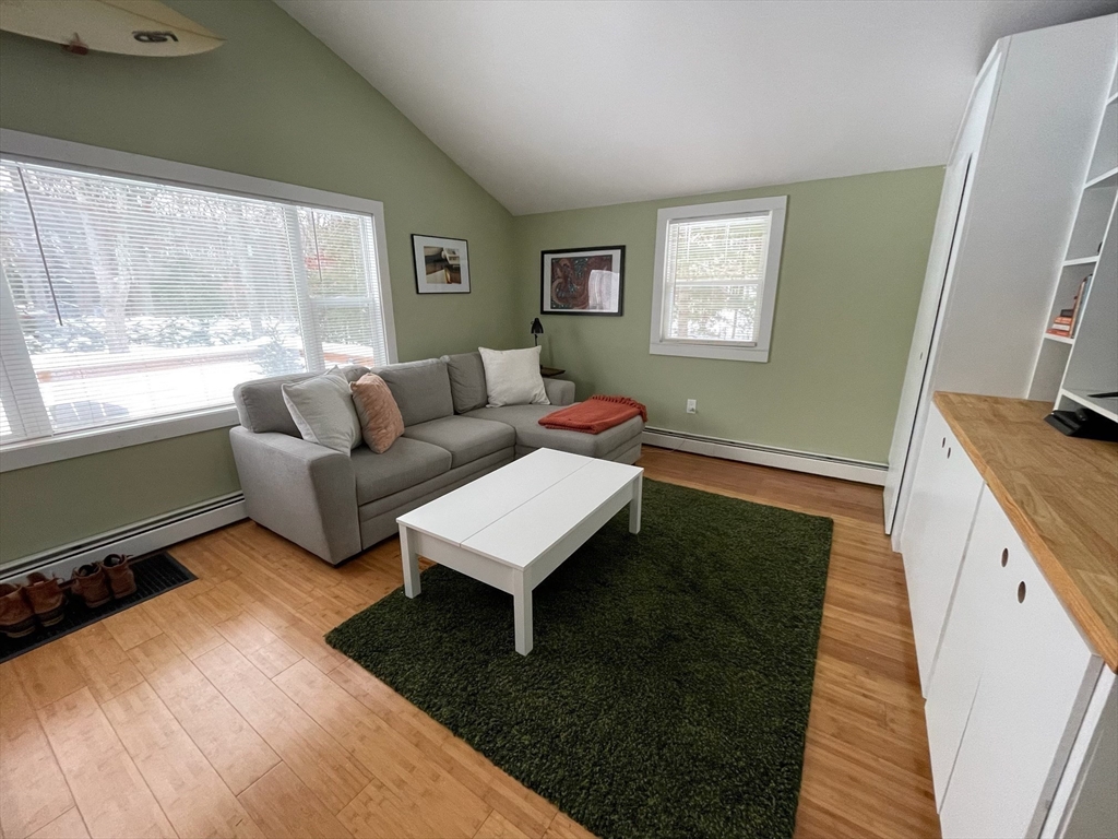 26 Highland Street Mashpee, MA 02649 - Photo 4 of 20 a living room with furniture and a window