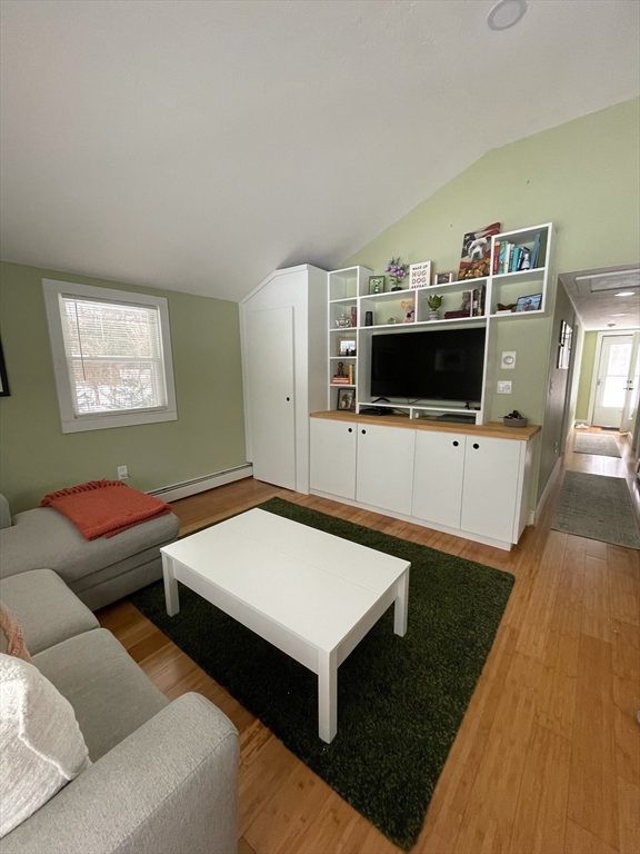 26 Highland Street Mashpee, MA 02649 - Photo 5 of 20 a living room with furniture and a flat screen tv