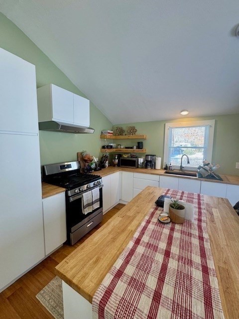 26 Highland Street Mashpee, MA 02649 - Photo 8 of 20 a kitchen with granite countertop stainless steel appliances and wooden cabinets