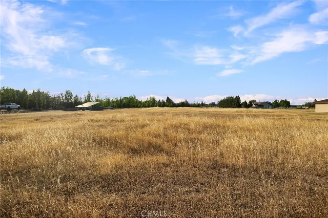 a view of a lake with houses in the back
