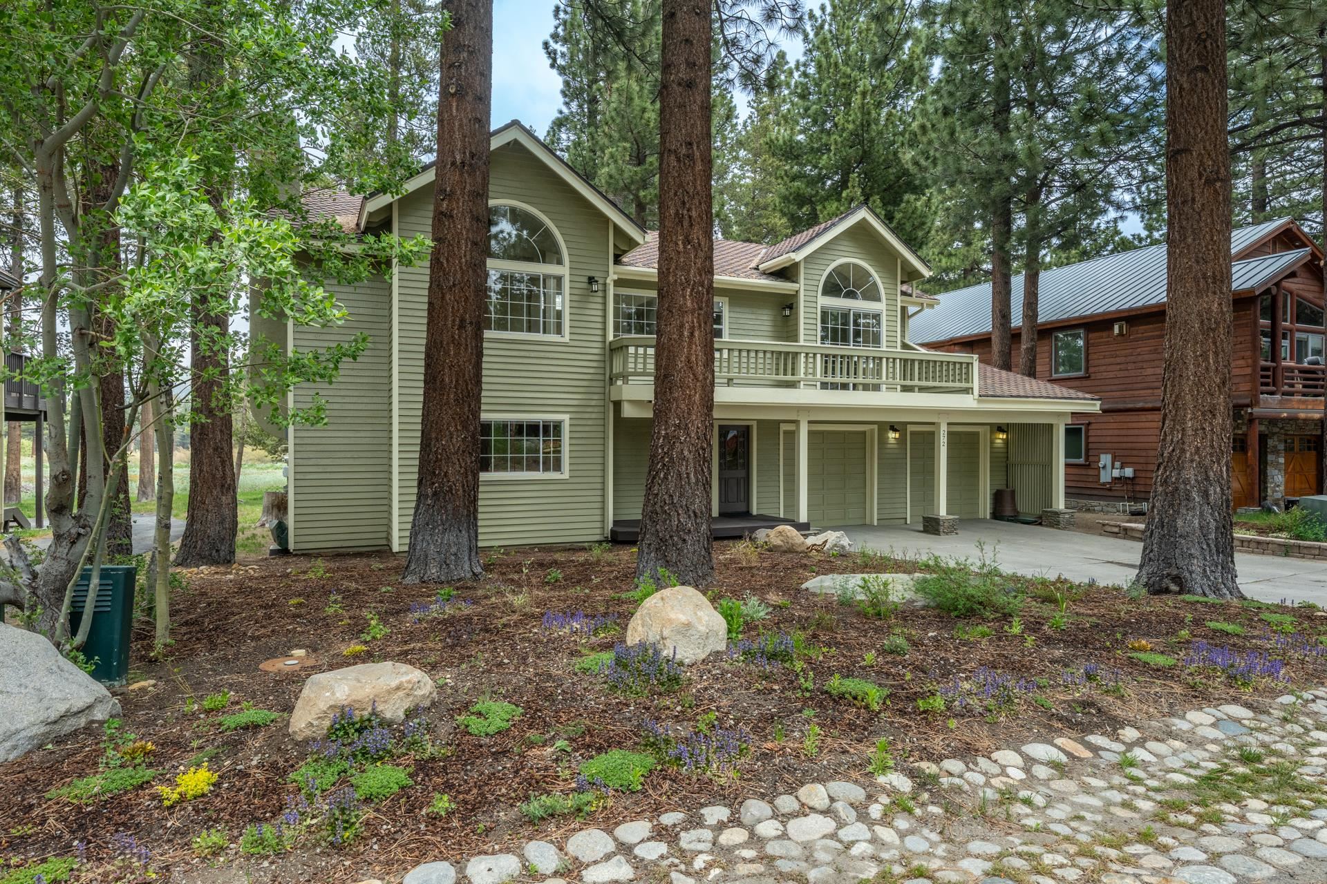 272 Ridge Way Mammoth Lakes, CA 93546 - Photo 2 of 55 Two-story residence featuring light green horizontal siding and a prominent second-story balcony with railings