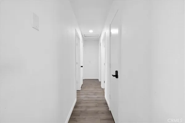 a bedroom with two beds and ceiling fan