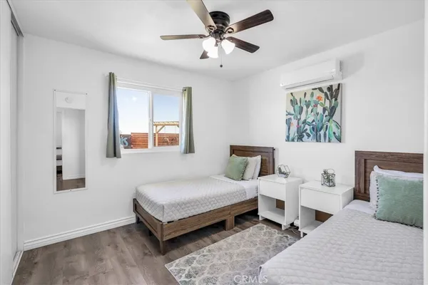 a bedroom with a bed and a couch