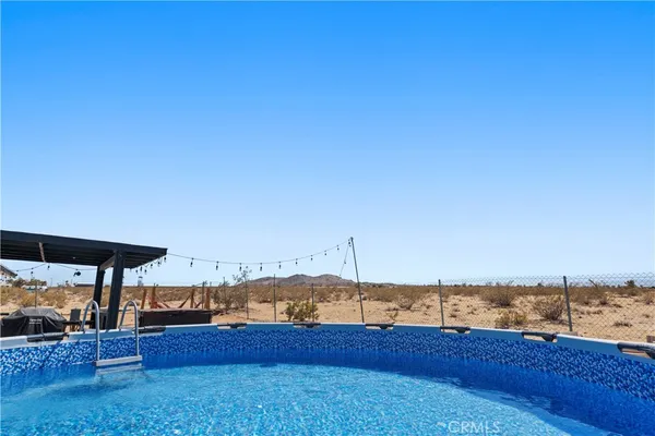 a view of a swimming pool with an ocean view