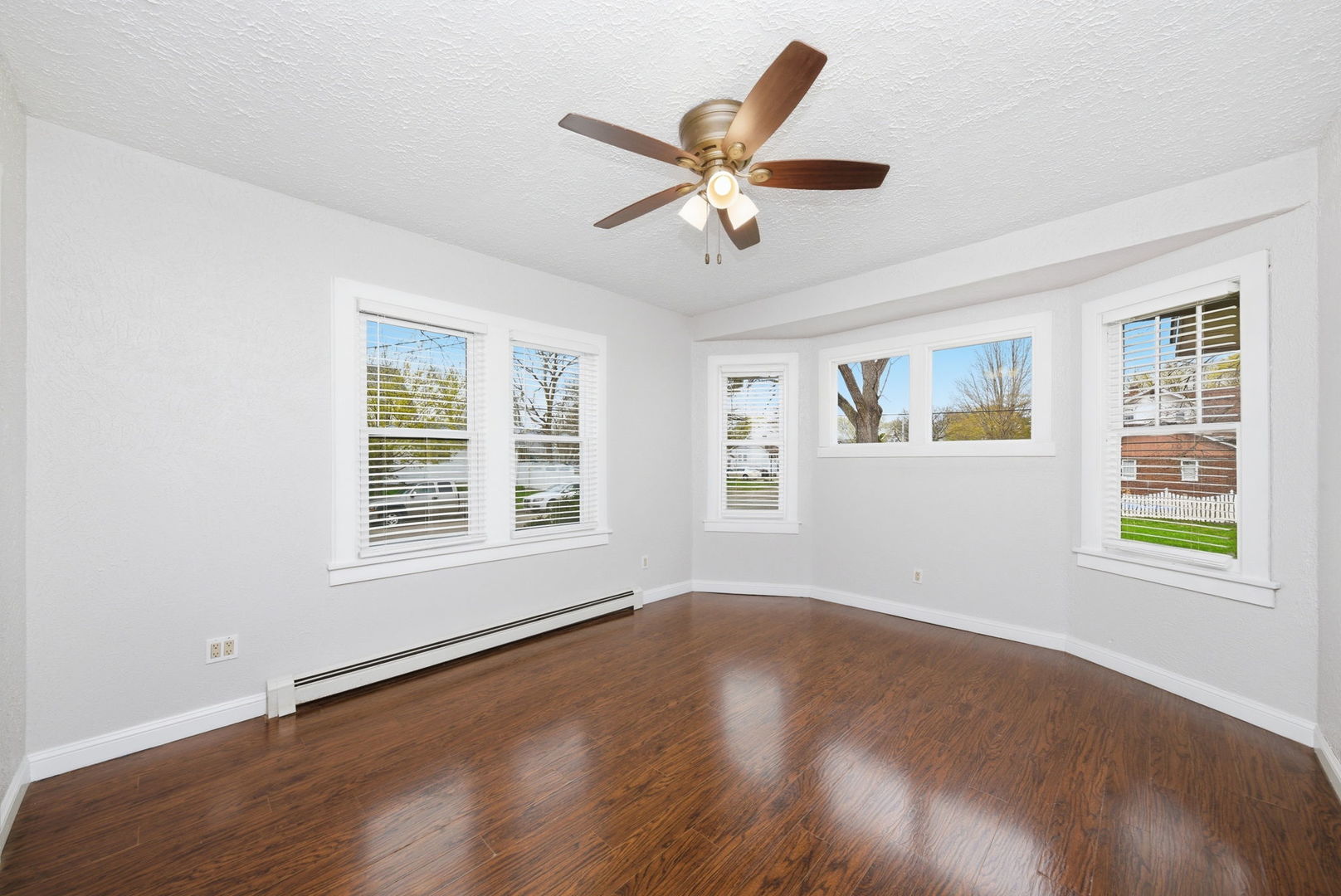 500 Catherine Street Ottawa, IL 61350 - Photo 6 of 23 a view of an empty room with wooden floor and a window