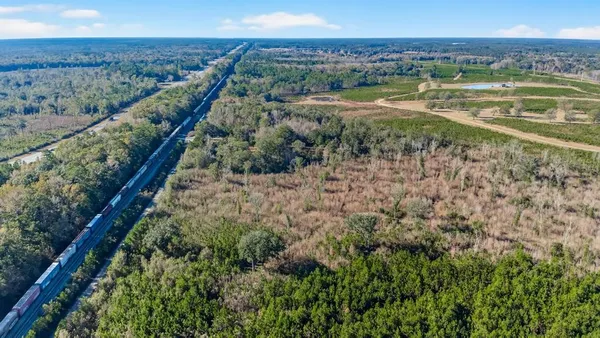 a view of a field with an outdoor space