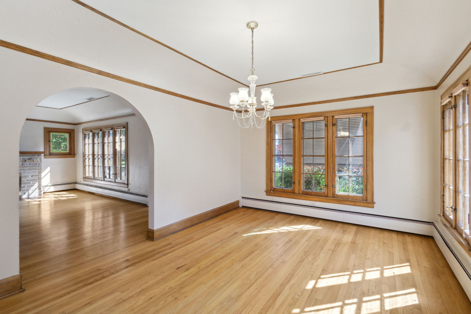 310 Bartram Road Riverside, IL 60546 - Photo 3 of 25 a view of an empty room with window and wooden floor