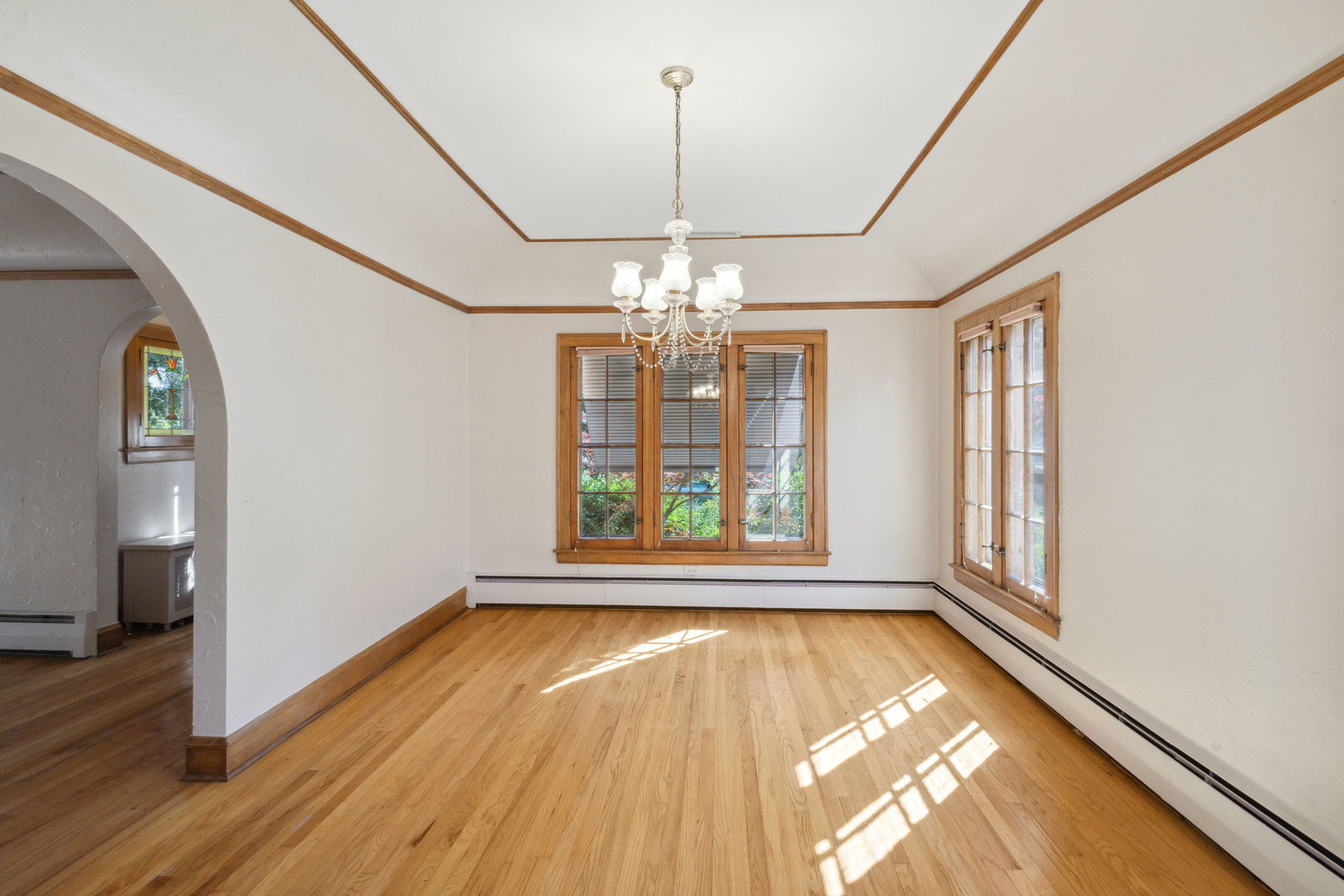 310 Bartram Road Riverside, IL 60546 - Photo 4 of 25 a view of an empty room with wooden floor and a window