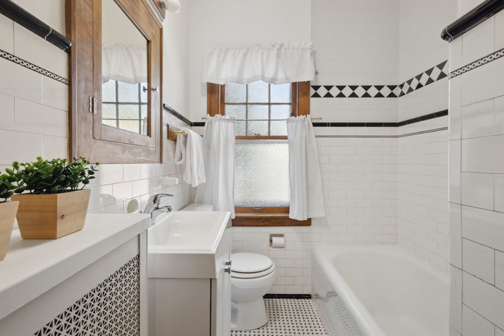 310 Bartram Road Riverside, IL 60546 - Photo 8 of 25 a bathroom with a sink a toilet and shower