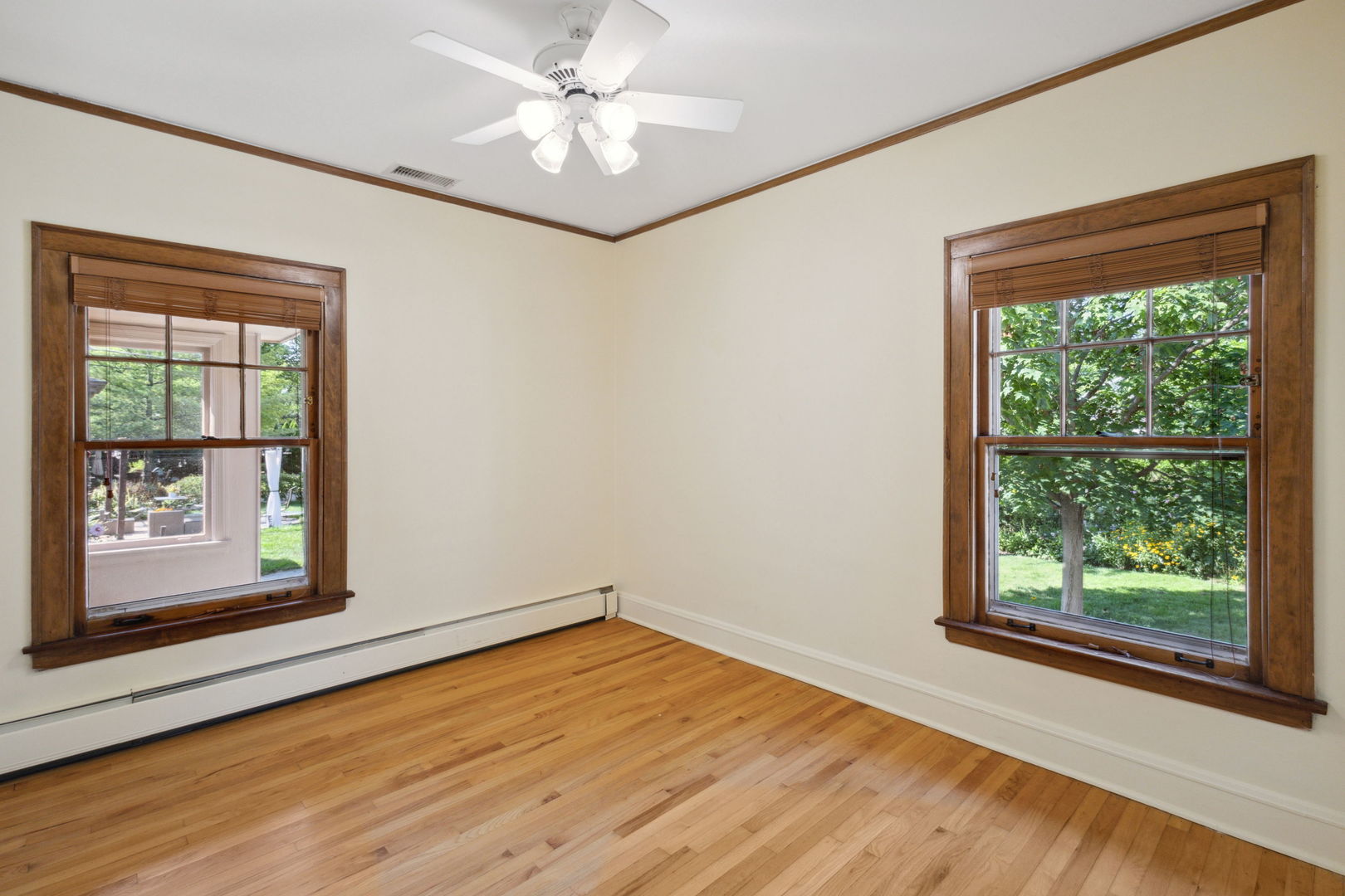 310 Bartram Road Riverside, IL 60546 - Photo 10 of 25 a view of an empty room with a window and wooden floor