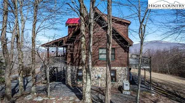 a view of a house with a tree