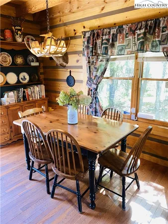 a view of a dining room with furniture and window