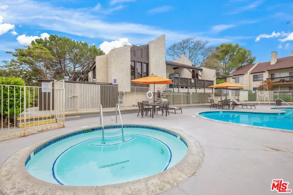 a view of a swimming pool with a patio