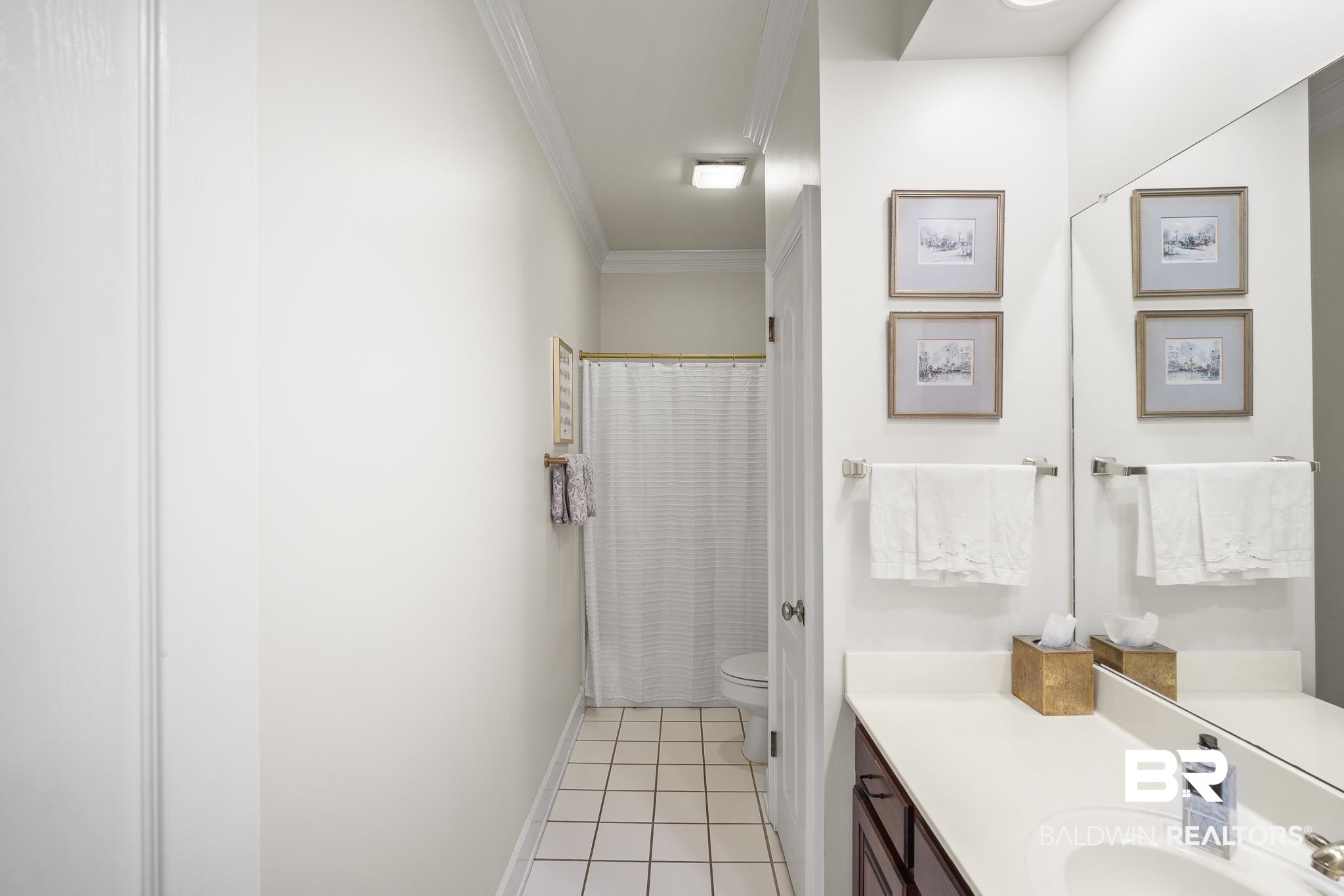 402 Potters Mills Road Daphne, AL 36526 - Photo 20 of 45 Bathroom featuring ornamental molding, toilet, vanity, tile patterned flooring, and baseboards